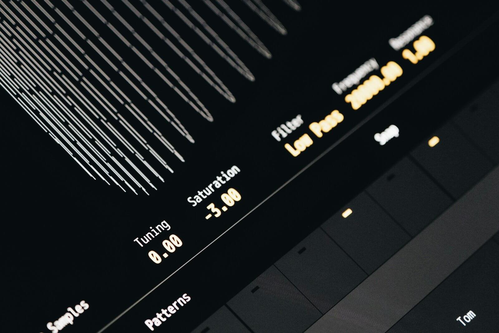 Close-up of a drum machine screen showing a Saturation setting of -3.00 next to Tuning and a low-pass Filter